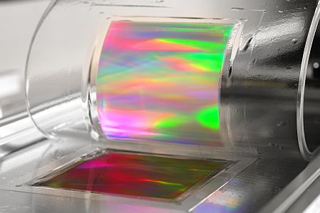 A stamp is produced for use in manufacturing an optical interference screen for diffracting light.