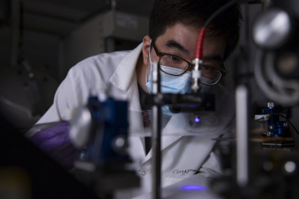 Jay Guo working with equipment